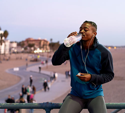 Young man drinking water